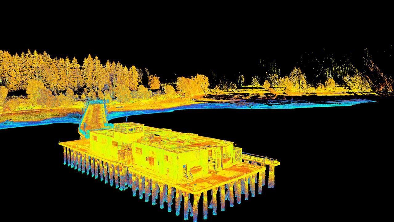 Black background with yellow and orange point cloud of a building